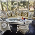F25. White wicker furniture. 